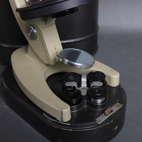 3072 - A Russian mid-century monocular microscope, number 7215076, with original fitted metal casing.