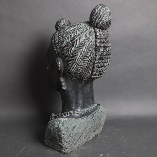 3094 - A large green stone bust of an African woman, unsigned, height 45cm.