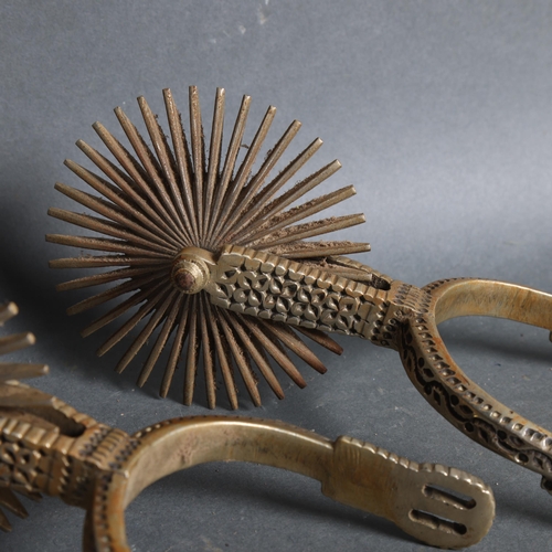 3108 - A pair of South American decorative polished metal spurs.