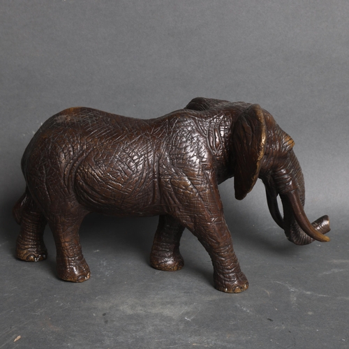 3117 - A bronze study of an African elephant, unsigned, height 17cm.