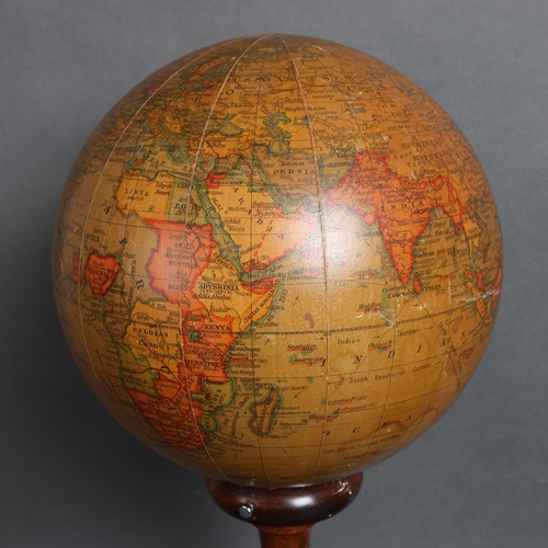 3124 - A 1920's 'Geographia', 8 inch, terrestrial revolving globe lamp on beechwood stand, height 42cm.