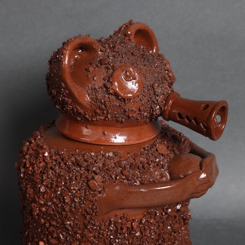 3125 - A Staffordshire style glazed terracotta brown bear jar with impressed mark to base, height 23cm.