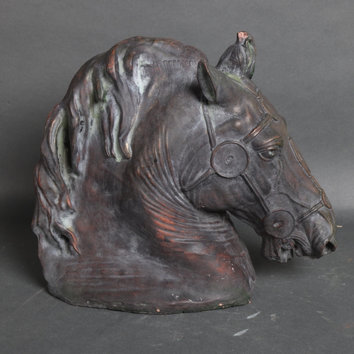 3135 - A terracotta verdigris study of a horse head, unsigned, height 30cm.