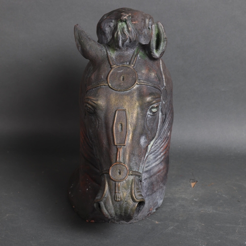 3135 - A terracotta verdigris study of a horse head, unsigned, height 30cm.