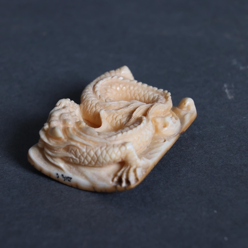 3160 - Netsuke: Dragon, carved from Mammoth tusk ivory
Exquisitely carved from this ~15,000 year old materi... 