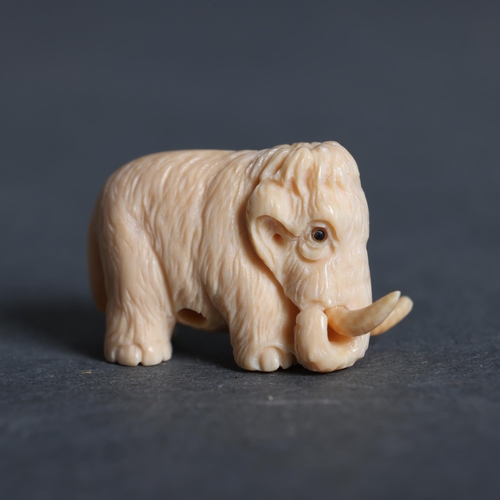 3163 - Netsuke: Mammoth carved from Mammoth tusk ivory 
superb miniature carving of a mammoth hand carved f... 