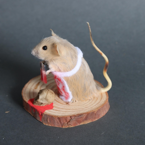 2996 - Taxidermy Mouse holding cleaver. An anthropomorphic full mount taxidermy mouse, mounted upright on a... 