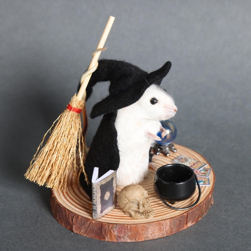 2998 - Taxidermy Witch Mouse. An anthropomorphic full mount taxidermy mouse, mounted upright on a slice of ... 