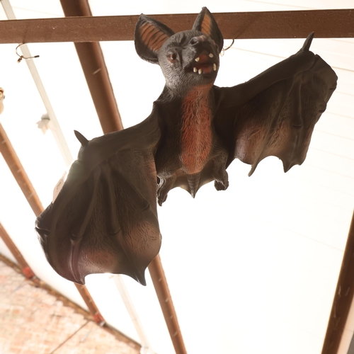 3362 - A large hanging vinyl model of a bat.