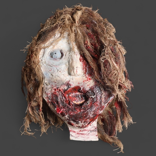 3390 - Curiosity/Macabre : A large papier-mâché wall hanging, study of a horror mask, length 75cm.