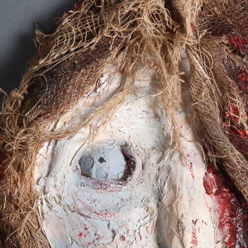 3390 - Curiosity/Macabre : A large papier-mâché wall hanging, study of a horror mask, length 75cm.