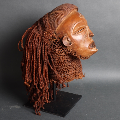 3393 - Chokwe (Uganda), a tribal mask on metal stand, unsigned, height 13cm.