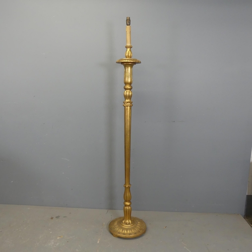 2708 - A fluted giltwood standard lamp, height to bayonet 160cm. For re-wiring.