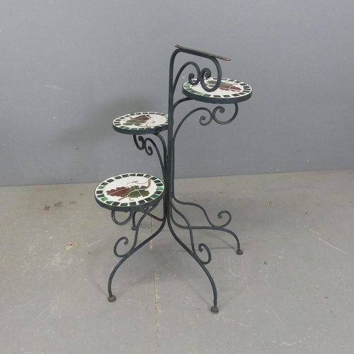 2709 - A painted metal folding triple plant stand, with mosaic top tiers. Height 70cm.