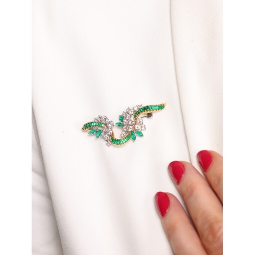 7 - An Emerald and Diamond Brooch,

of ribbon form, claw-set with a row of rectangular step cut emeralds... 