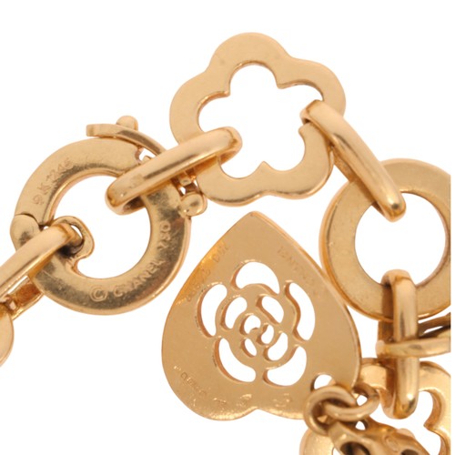 11 - CHANEL - A 'Camelia' Charm Bracelet,

the camelia and hoop link bracelet with 9 Chanel removeable ch... 