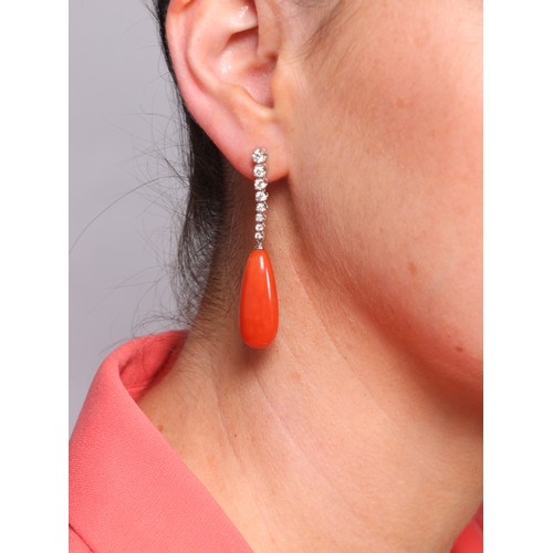 9 - A Pair of Coral and Diamond Drop Stud Earrings, 

the teardrop-shaped coral suspended from an articu... 