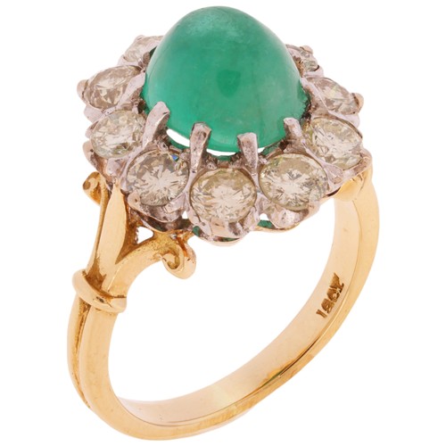 8 - An Emerald and Diamond Cluster Ring, 

claw set with an oval cabochon emerald of approximately 3.00 ... 