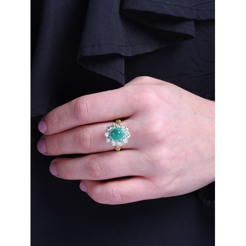 8 - An Emerald and Diamond Cluster Ring, 

claw set with an oval cabochon emerald of approximately 3.00 ... 