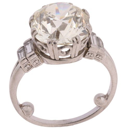 25 - An Art Deco 7.14ct Single Stone Diamond Ring, 

circa 1920, split claw set with 7.14 carat old trans... 