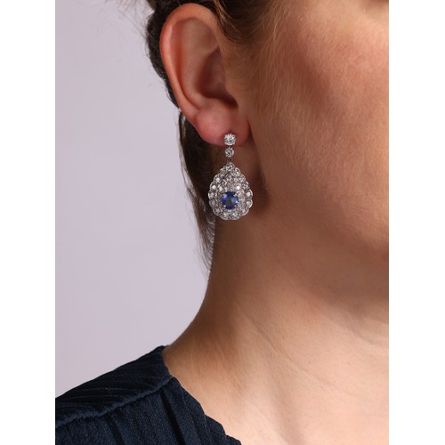 19 - A Pair of Sapphire and Diamond Stud Earrings,

the pear cluster drops set with oval mixed cut sapphi... 