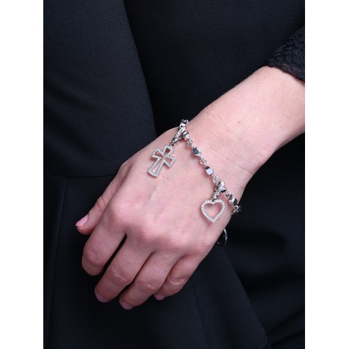 33 - THEO FENNELL - A Diamond Charm Bracelet, 

the solid cube links with four pave set modern round bril... 