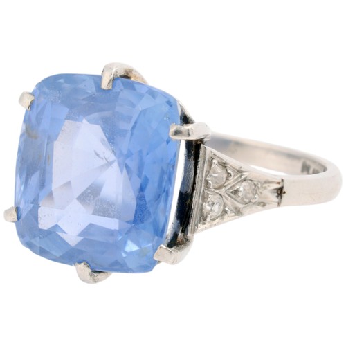 20 - A Sri Lankan No Heat Sapphire and Diamond Ring,

circa 1910, claw set with a cushion cut sapphire of... 