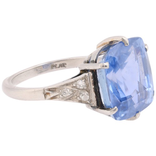 20 - A Sri Lankan No Heat Sapphire and Diamond Ring,

circa 1910, claw set with a cushion cut sapphire of... 