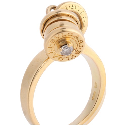 73 - BULGARI - A Diamond 'B.zero1' Dangling Barrel Ring,

the barrel set with a modern round brilliant-cu... 