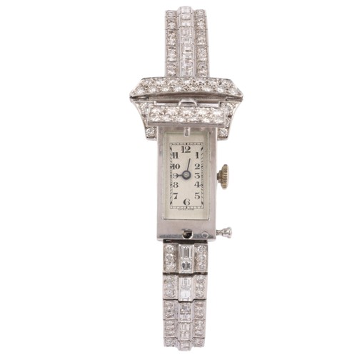 68 - An Art Deco Lady's Platinum and Diamond Bracelet Watch, 

circa 1930, the rectangular silvered dial ... 