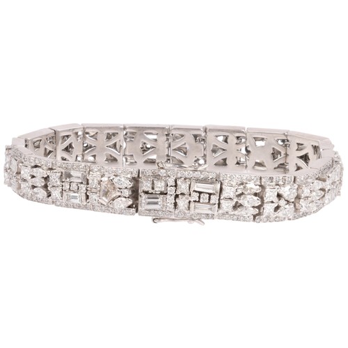 47 - A Diamond Bracelet,

each panel centrally set with vari-cut diamonds including shield baguette marqu... 