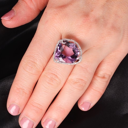 41 - An Amethyst and Diamond Ring,

set with a fantasy-cut amethyst of approximately 15.00 carats, surrou... 