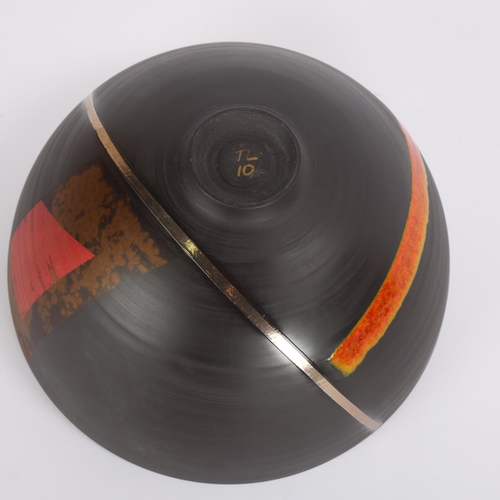 10 - TONY LAVERICK (b.1961), a black porcelain studio pottery bowl, with coloured and lustre glazes, init... 