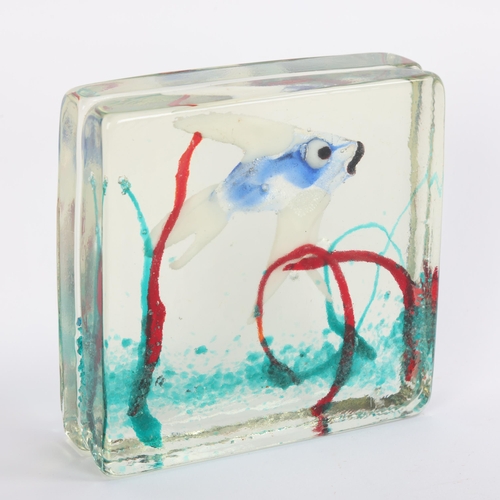 21 - A Murano style aquarium glass block showing a single tropical fish swimming in reeds, height 12.5cms... 