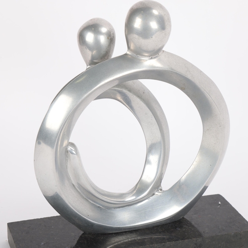 46 - A modernist aluminium sculpture of two  figures, on polished granite base, height 23cm