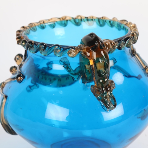 47 - A large cobalt blue glass bowl in the style of Moser, with applied amber coloured crocodiles and tra... 