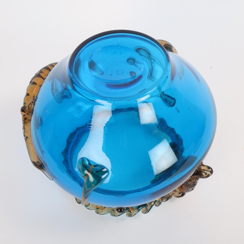 47 - A large cobalt blue glass bowl in the style of Moser, with applied amber coloured crocodiles and tra... 