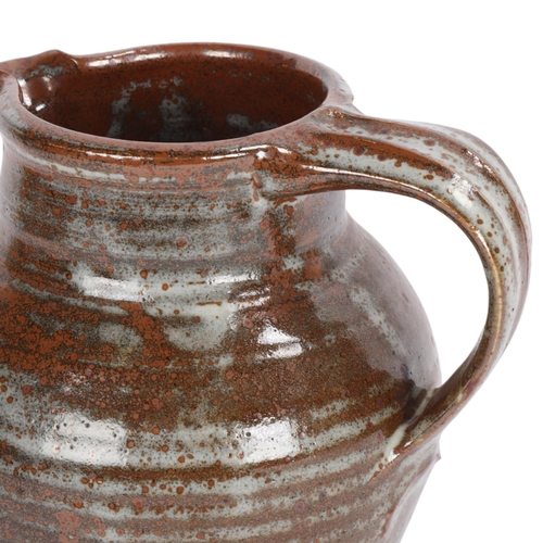 51 - FRANK SMITH (1927-1994), a stoneware studio pottery jug with tenmoku glaze, makers mark to base, hei... 