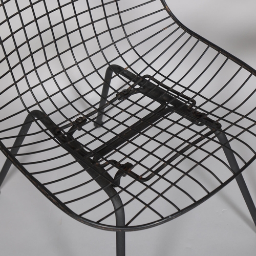 61 - A pair of RAY and CHARLES EAMES designed black wire DKR chairs, no makers marks