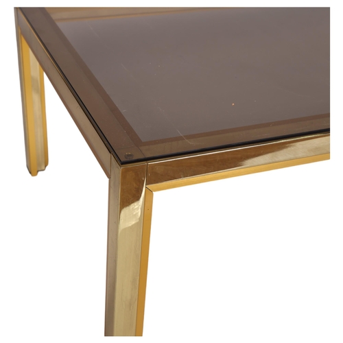 63 - A 1970s' Renato Zevy, Italian coffee table, with smoked glass top on brass/gilt frame, top 130 x 60c... 