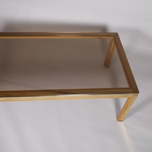 63 - A 1970s' Renato Zevy, Italian coffee table, with smoked glass top on brass/gilt frame, top 130 x 60c... 