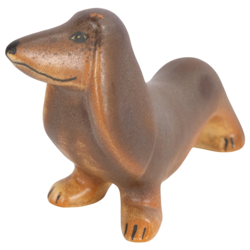 70 - LISA LARSON for Gustavsberg, a ceramic figurine of a “dashing” dashund from the second kennel series... 