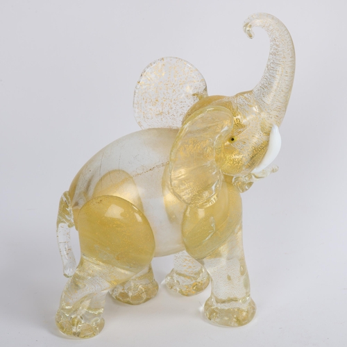 100 - Attributed to FRATELLI BAROVIER (Murano), a 1930’s/40’s pale amber and clear glass elephant with gol... 