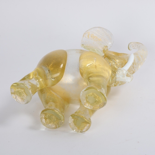 100 - Attributed to FRATELLI BAROVIER (Murano), a 1930’s/40’s pale amber and clear glass elephant with gol... 