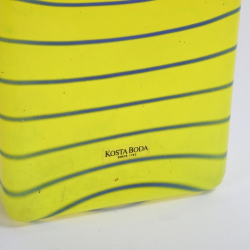 104 - ANNA EHRNER for Kosta Boda, a Flask in yellow glass with a blue trail, with stopper, signed: Kosta B... 