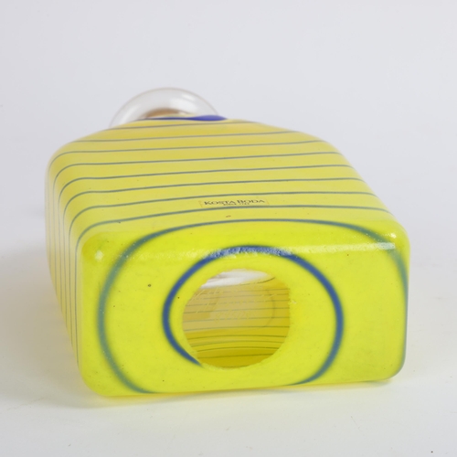 104 - ANNA EHRNER for Kosta Boda, a Flask in yellow glass with a blue trail, with stopper, signed: Kosta B... 