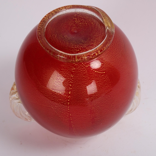 132 - Seguso Vetri d’Arte (Murano), a red vase on foot with gold leaf with scrolled handles, 1950s' produc... 