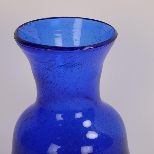 137 - ERIK HOGLUND for Boda, a 1950’s Erik Hoglund vase in blue glass with internal air bubbles, signed on... 