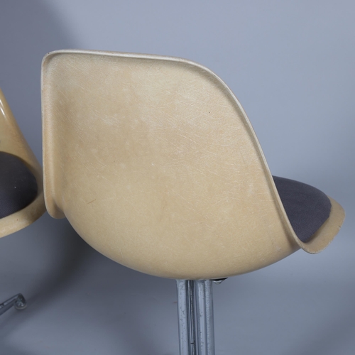 140 - CHARLES EAMES, a pair of Vitra fibre glass side chairs with upholstered seat and on rare La Fonda ba... 