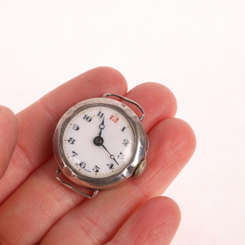 1060 - An early 20th century silver Officer's style mechanical wristwatch head, circa 1920s, white enamel d... 